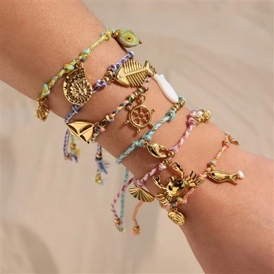 Bracciale a tirante intrecciato con fascino oceanico